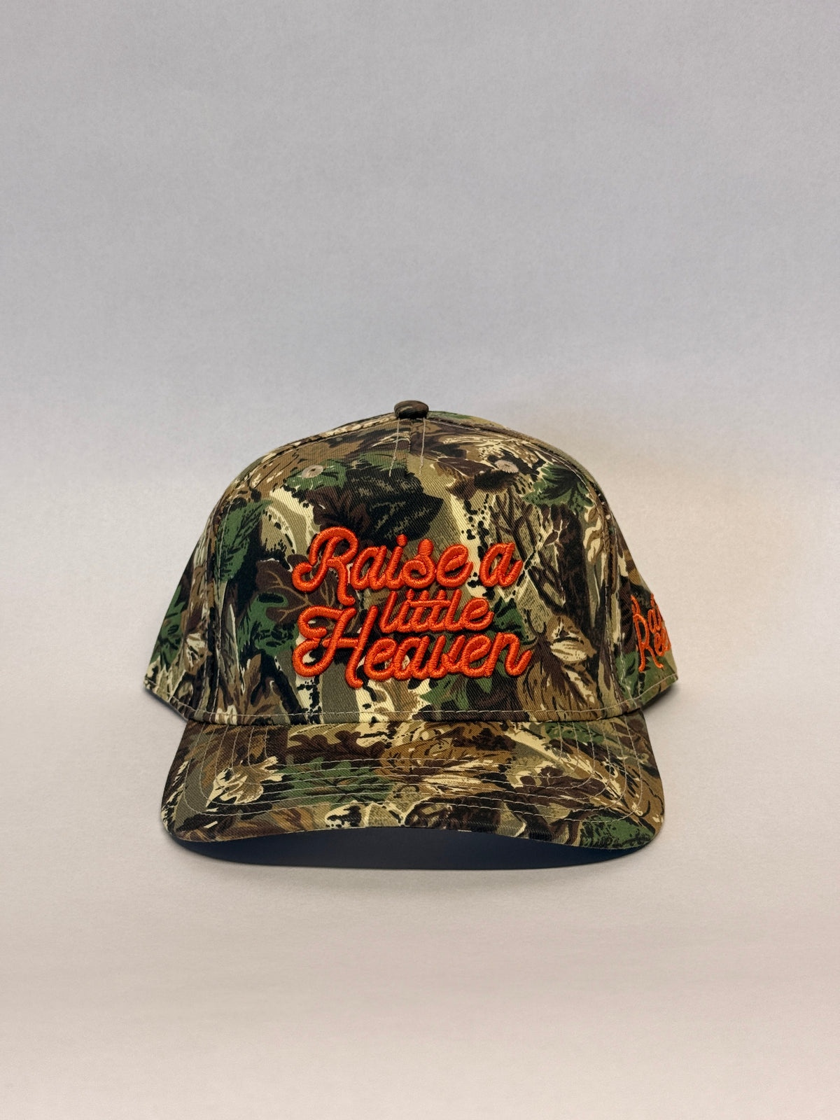 RAISE A LITTLE HEAVEN Puff Embroidery Camo Otto Hat